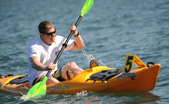 Sport man is kayaking